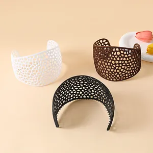 Detailed view of fashionable mesh hijab headbands in white, brown and black colors.