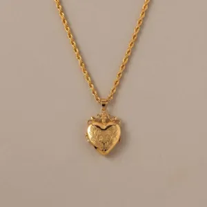 Vintage gouden hart medaillon halsketting met touwketting en elegant gegraveerd sieraad.