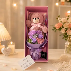 Valentine gift box with a cute pink teddy bear doll and purple soap rose flower bouquet.