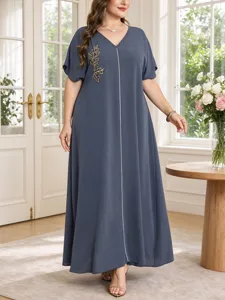 Plus-size summer V-neck leaf embroidered loose short sleeve long dress elegant detail view.