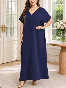 Plus size long dress with V-neck, short sleeves, and elegant gold leaf embroidery in navy.