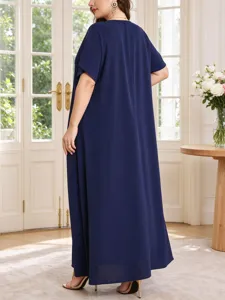 Detail view of plus size loose summer maxi dress with short sleeves in solid navy blue.