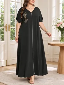 Elegant plus size black V-neck maxi dress featuring gold leaf embroidery and short sleeves.