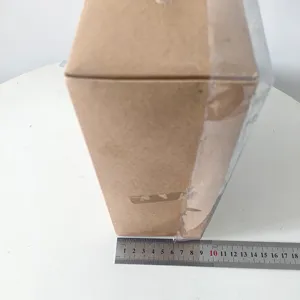 Detail view of the packaging box with measurement ruler, showing dimensions for Christmas ornaments.