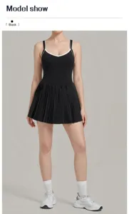Black athletic tennis dress with pleated skirt and contrast color straps for fitness workouts.