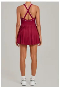 Detailed back view of activewear tennis dress with cross straps and pleated skirt hem.