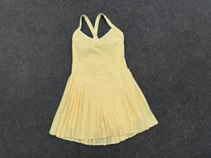 Yellow tennis dress activewear pleated skirt sporty mini dress V-neck sleeveless athletic outfit.