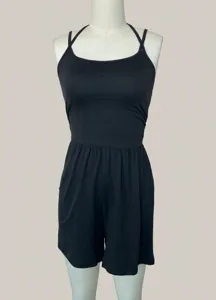 Black spaghetti strap romper for women, casual slim waist and loose wide leg shorts.