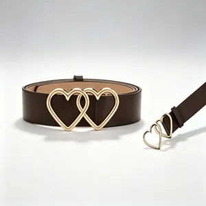 Close-up detail view of the brown PU leather belt featuring stylish interlocking gold heart buckle.