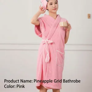 Detailed view of the soft pink waffle bath robe with matching hair drying cap for women.