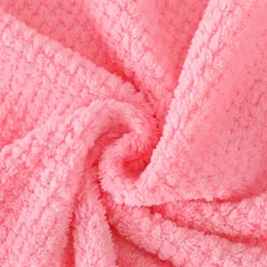 Pink pineapple grid towel fabric detail close up, soft breathable absorbent quick drying material.