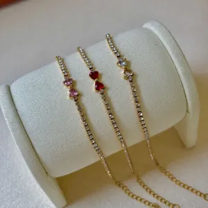 Bracciali tennis dorati con strass di cristallo e ciondoli a cuore colorati vista principale