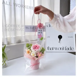 Handmade crochet flower bouquet detail view pink knit rose gift bag delicate desktop decor