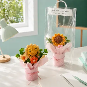 Handmade crochet sunflower bouquet in pink hug bucket with clear gift bag for creative gifts.