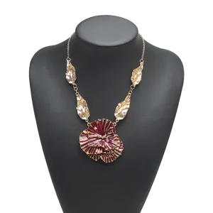 Exquisite artistic floral pendant necklace with layered burgundy flower and gold leaf chain.