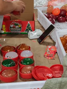 Christmas squishy bun stress relief toys with red steamer container gift box packaging.