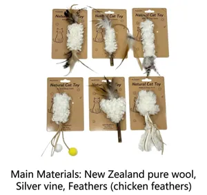 Natural cat toy set featuring wool and feathers with wooden sticks. Detailed view of pet items.