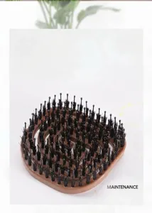 Curved boar bristle hair brush for detangling and scalp massage, portable styling tool.