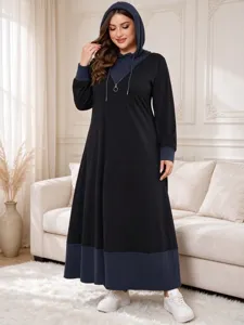 Plus size casual hooded maxi dress featuring color block splicing, long sleeves and half zip detail.