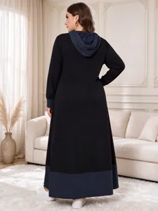 Detailed view of the contrast-hooded plus-size long dress, highlighting ribbed cuffs and hem.