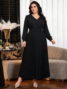 Plus size long sleeve black maxi dress with lace V-neck and pleated skirt for autumn fashion.