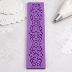 Detailed shot of purple silicone lace fondant mold showing intricate floral patterns for baking.