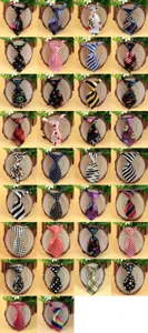 Detailed view of various cute printed polyester pet and baby ties, assorted patterns.