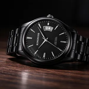 Close-up detail of the black metal quartz watch showcasing dial and steel strap texture.