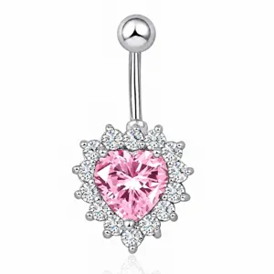 Close-up of pink heart cubic zirconia navel piercing ring, sparkling halo design detailed.