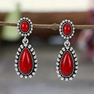 Vintage red turquoise drop earrings detail view, antique silver tone bohemian statement jewelry.