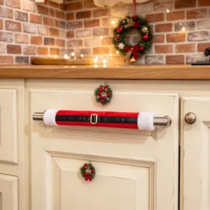 Christmas appliance handle cover detail showing the festive Santa belt design on a kitchen door.