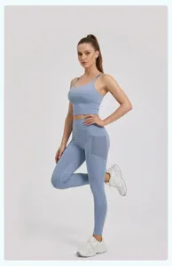 High waist yoga set with mesh side pockets, stretchy athletic fitness tights and sports bra.