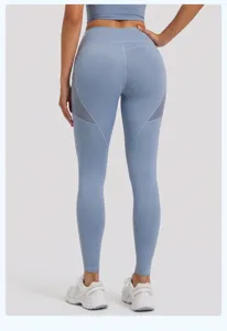 Back view of high waist yoga pants with mesh side pockets, stretchy fitness activewear leggings.