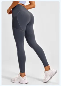 Close up detail of high waist mesh side pocket yoga pants, stretch athletic leggings back view.