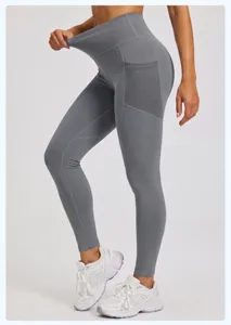 High-waist grey yoga pants with side mesh pockets, elastic fitness running leggings.