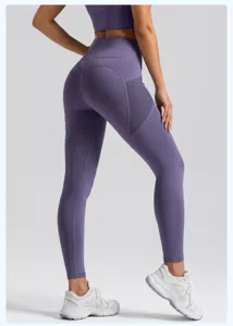 Detailed view of high-waist yoga pants with mesh side pockets, stretch athletic leggings.