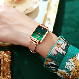 Vintage green dial rectangle quartz watch detail featuring rose gold mesh strap.