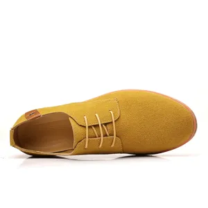 Yellow suede casual shoe detail, flat lace-up low top design, comfortable footwear texture