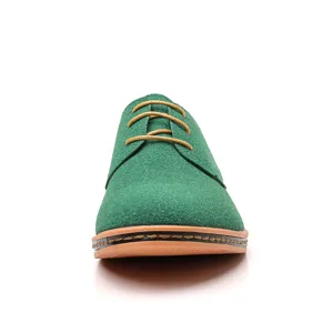 Close-up detail view of green suede men casual derby shoes featuring yellow laces and stitching.