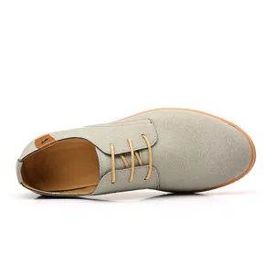 Men grey suede casual lace-up shoe detail, low-top flat design with contrast laces.