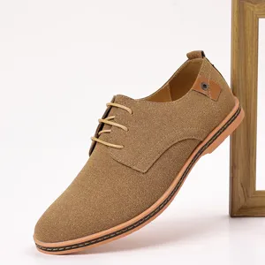Detail view of men's brown suede casual lace-up leather shoe showing texture and stitching.