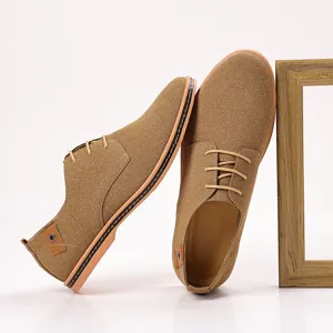 Brown suede casual shoes detail view, men lace-up footwear showing soft texture and fine stitching.