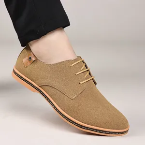 Men's casual suede lace-up shoes close-up view, stylish brown footwear for daily wear.