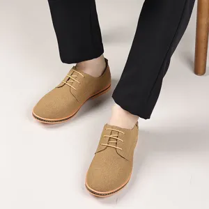 Men casual suede lace-up shoes close-up detail, classic brown fashion footwear design.