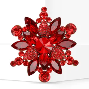 Red crystal rhinestone snowflake brooch detail, exquisite alloy fashion jewelry accessory.