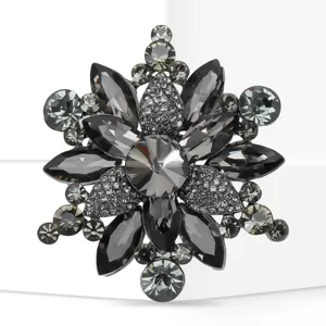 Detail shot of a sparkling gray crystal rhinestone flower brooch, elegant alloy fashion accessory.