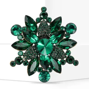 Close up detail view of elegant green crystal rhinestone alloy fashion brooch pin