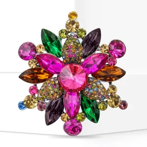 Close-up detail of multi-color crystal rhinestone flower brooch, vibrant gemstone sparkle.