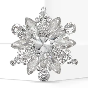 Crystal rhinestone snowflake brooch detail close up sparkling clear diamond silver tone alloy