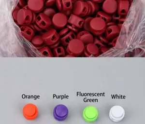 Colorful plastic cord locks detail showing multi-color spring stoppers with double holes.